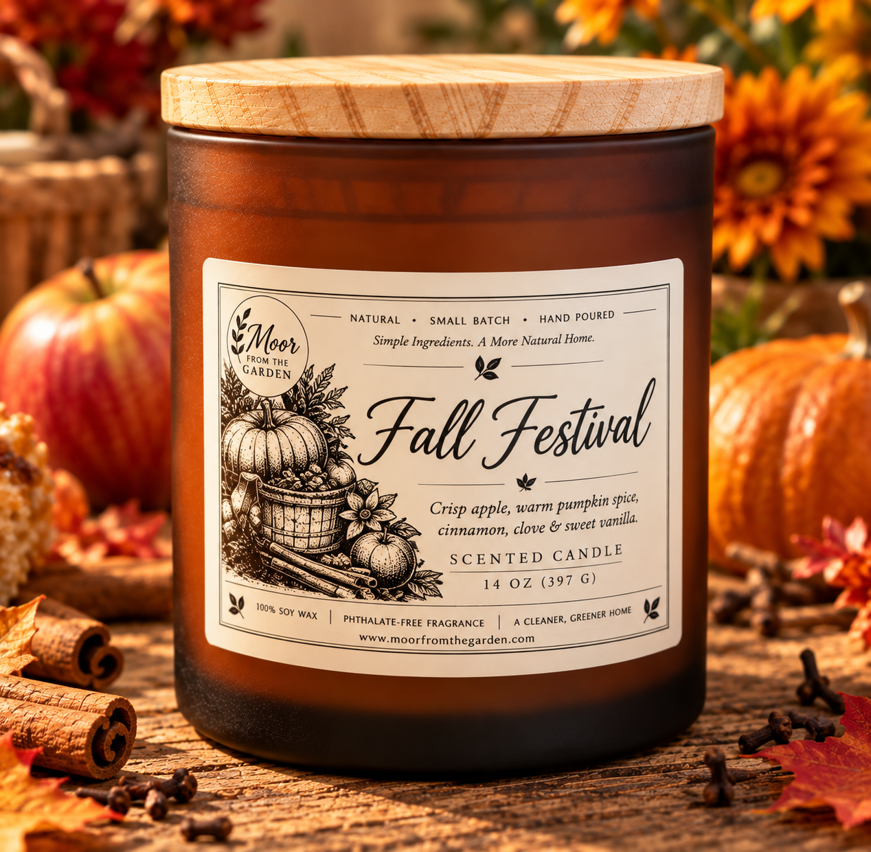Fall Festival candle on weathered wood with pumpkins, cinnamon sticks, autumn mums and cloves